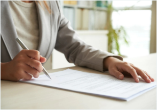 cropped-mid-section-unrecognizable-woman-signing-document_1098-18908
